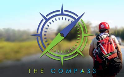 Compass graphic over man rescuing animals